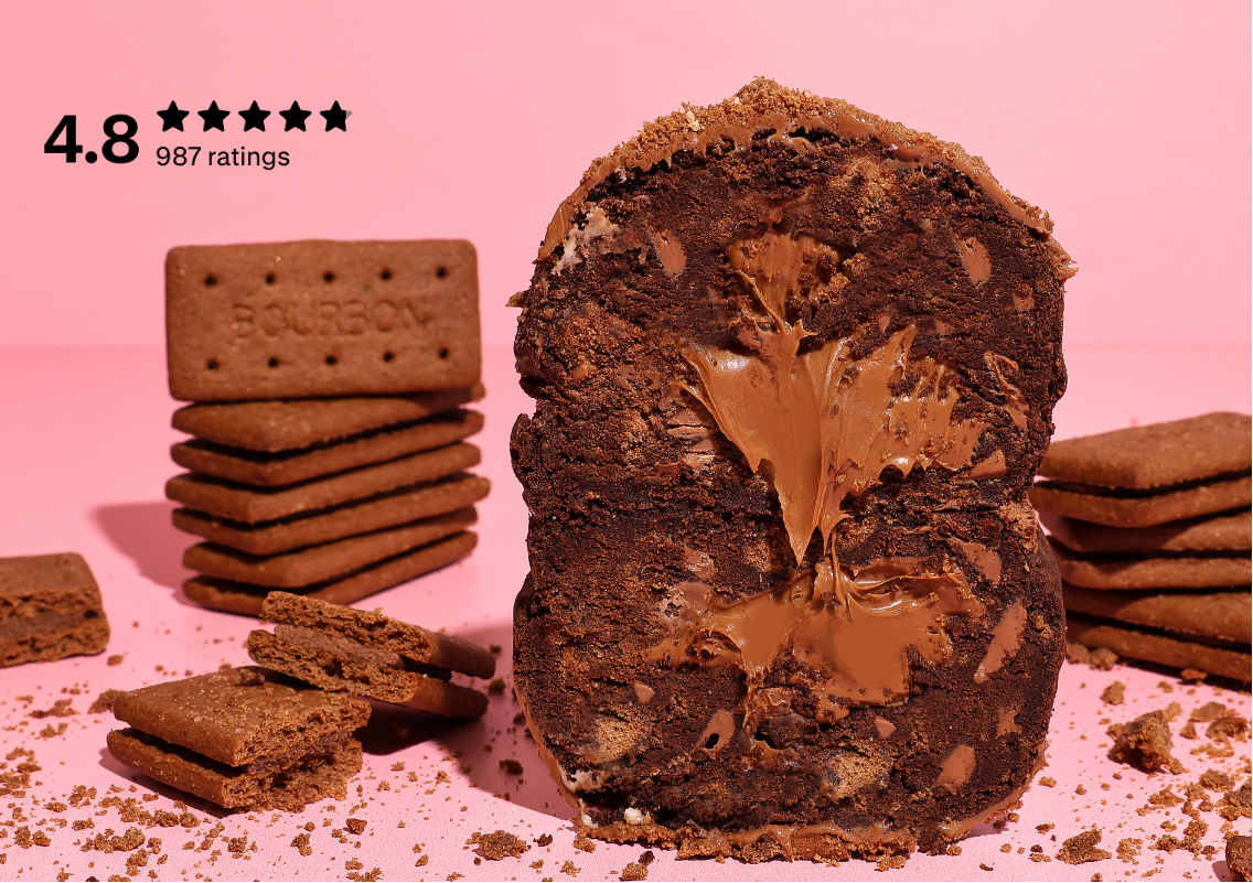 Chocolate sandwich cookie with a thick layer of chocolate spread inside, styled on a pink background with stacked cookies and crumbs. A '4.